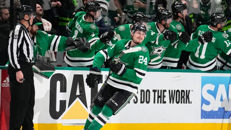 Dallas Stars centre Roope Hintz (24) smiles as he celebrates with the bench after scoring against the Seattle Kraken in the second period of Game 7 of an NHL hockey Stanley Cup second-round playoff series, Monday, May 15, 2023, in Dallas. (Tony Gutierrez/AP)