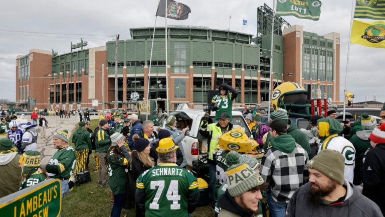 Fans tailgate outside Lambeau Field before an NFL football game between the Dallas Cowboys and Green Bay Packers, Sunday, Nov. 13, 2022, in Green Bay, Wis. (Mike Roemer/AP)