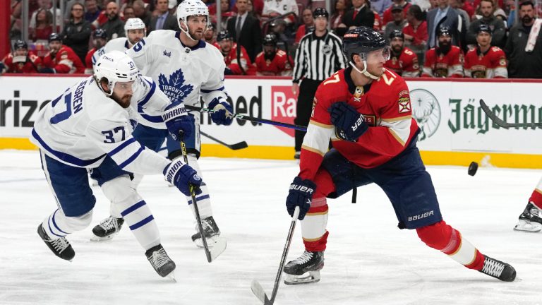 Toronto Maple Leafs defenceman Timothy Liljegren (37) shoots as Florida Panthers centre Eetu Luostarinen (27) defends during the first period of Game 4 of an NHL hockey Stanley Cup second-round playoff series Wednesday, May 10, 2023, in Sunrise, Fla. (Lynne Sladky/AP)