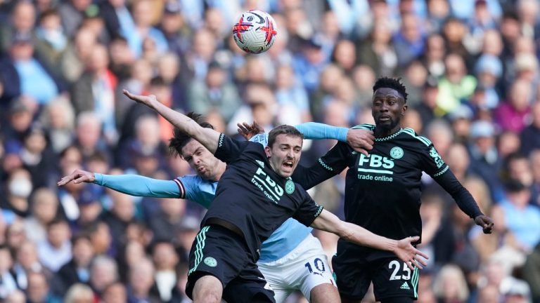 Leicester's Timothy Castagne, left, challenges for the ball with Manchester City's Jack Grealish during the English Premier League soccer match between Manchester City and Leicester City at Etihad Stadium in Manchester, England, Saturday, April 15, 2023. (Dave Thompson/AP)