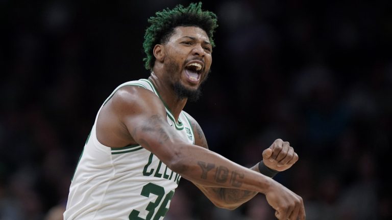 Boston Celtics guard Marcus Smart celebrates after the Celtics scored during the second half of an NBA basketball game against the Charlotte Hornets, Monday, Nov. 28, 2022, in Boston. (Steven Senne/AP)