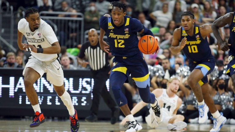 Marquette's Olivier-Maxence Prosper (12) dribbles the ball after a turnover during the second half of an NCAA college basketball game against Providence. (Stew Milne/AP)