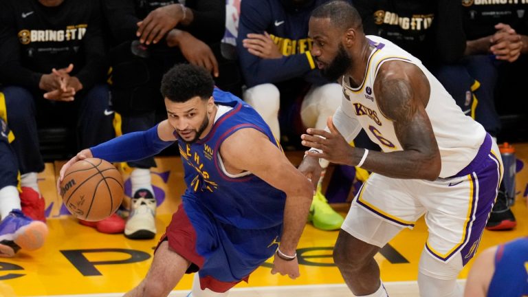 Denver Nuggets guard Jamal Murray (27) is defended by Los Angeles Lakers forward LeBron James in the first half of Game 3 of the NBA basketball Western Conference Final series. (Ashley Landis/AP)