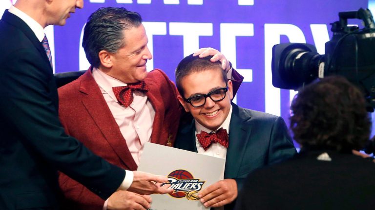 In this May 21, 2013, file photo, Cleveland Cavaliers owner Dan Gilbert congratulates his son, Nick Gilbert, after the team won the NBA basketball draft lottery in New York. (Jason DeCrow/AP)