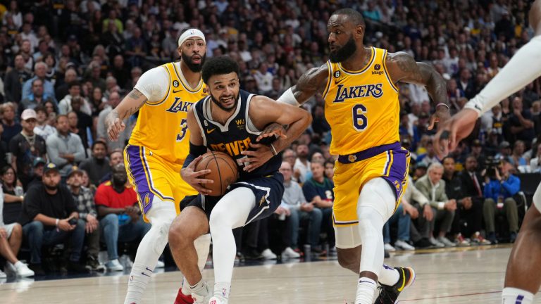 Denver Nuggets guard Jamal Murray is pressured by Los Angeles Lakers forward LeBron James (6) during the second half of Game 2 of the NBA basketball Western Conference Finals series, Thursday, May 18, 2023, in Denver. (Jack Dempsey/AP)