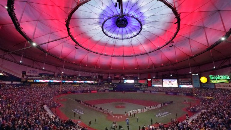 Red, white and blue colors are displayed on the dome of Tropicana Field during the national anthem before Game 1 of a baseball American League Division Series between the Tampa Bay Rays and the Boston Red Sox, Thursday, Oct. 7, 2021, in St. Petersburg, Fla. (John Raoux/AP)