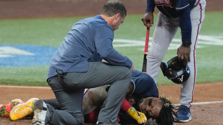 Atlanta Braves Ronald Acuna Jr. (13) falls to the ground after he was hit by a ball in the left leg during the sixth inning of a baseball game against the Miami Marlins, Thursday, May 4, 2023, in Miami. (Marta Lavandier/AP)