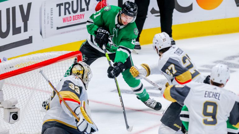 Dallas Stars left wing Jason Robertson, centre, shoots as Vegas Golden Knights goalie Adin Hill defends during the first period of Game 4 of the NHL hockey Stanley Cup Western Conference finals Thursday, May 25, 2023, in Dallas. (Gareth Patterson/AP)