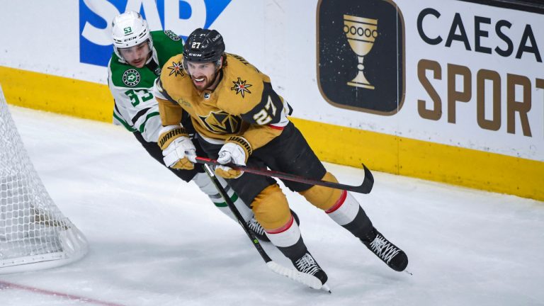 Vegas Golden Knights defenceman Shea Theodore (27) is pursued by Dallas Stars centre Wyatt Johnston (53) during the second period of Game 1 of the NHL hockey Stanley Cup Western Conference finals Friday, May 19, 2023, in Las Vegas. (Sam Morris/AP)