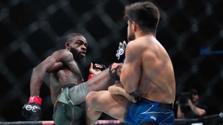 Aljamain Sterling, of Jamaica, kicks Henry Cejudo during the first round of a bantamweight title bout at the UFC 288 mixed martial arts event Sunday, May 7, 2023 in Newark, N.J. Sterling won the fight. (Frank Franklin II/AP)