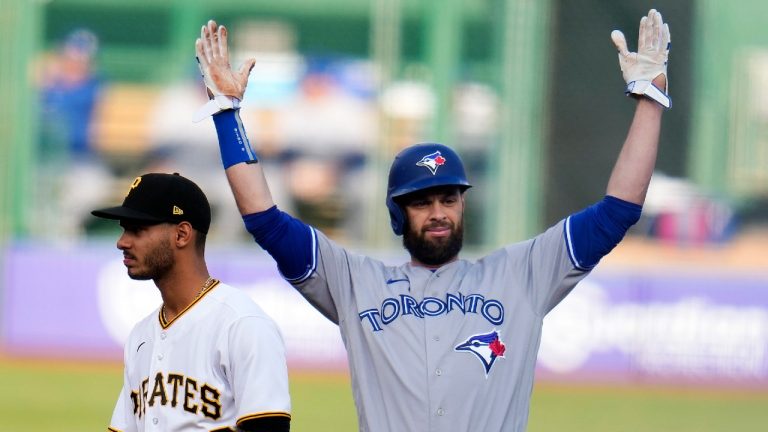 Toronto Blue Jays' Brandon Belt, right, celebrates as he stands on second base after driving in two runs with a double off Pittsburgh Pirates starting pitcher Johan Oviedo (not shown) during the first inning of a baseball game in Pittsburgh, Saturday, May 6, 2023. (Gene J. Puskar/AP)