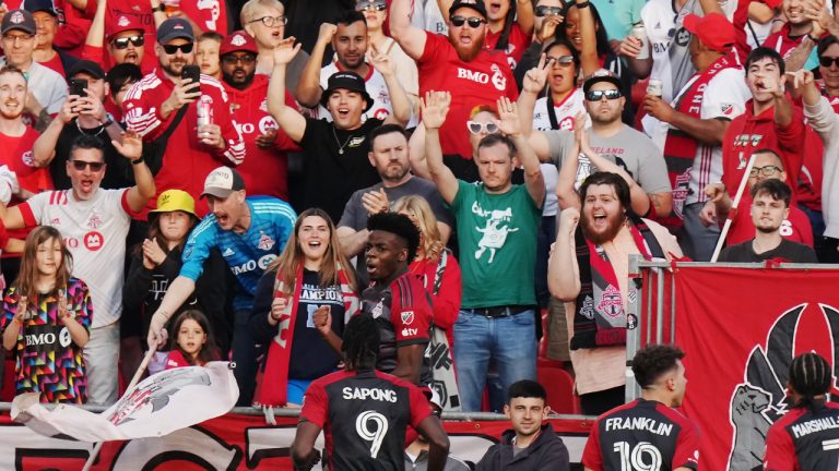 Toronto FC forward Deandre Kerr, centre, celebrates his goal against D.C. United with fans and teammates during first half MLS action in Toronto on Saturday, May 27, 2023. (Chris Young/CP)