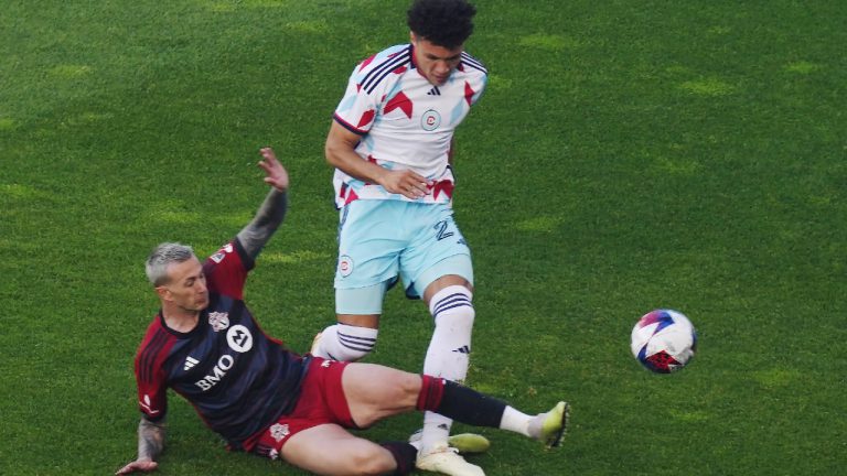 Toronto FC forward Federico Bernardeschi, left, slides at Chicago Fire defender Kendall Burks during first half MLS soccer action in Toronto on Wednesday, May 31, 2023. (Chris Young/CP)