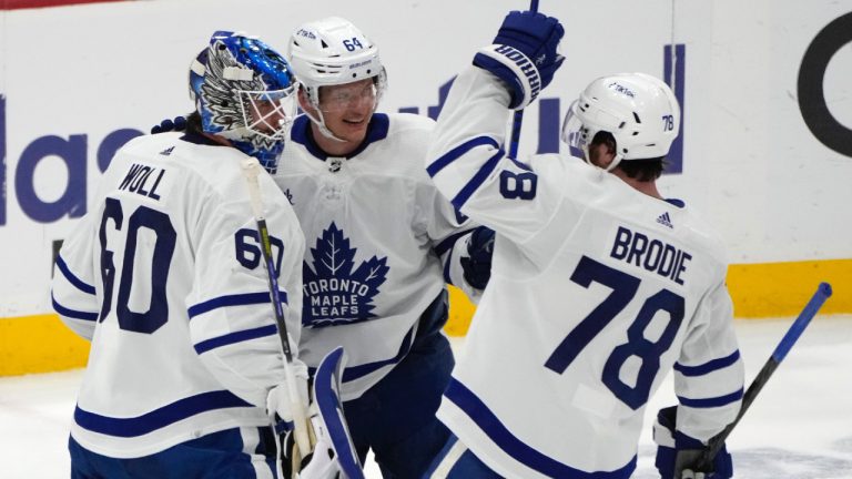 Toronto Maple Leafs goaltender Joseph Woll (60) celebrates with centre David Kampf (64) and defenceman TJ Brodie (78) after the team's win over the Florida Panthers in Game 4 of an NHL hockey Stanley Cup second-round playoff series Wednesday, May 10, 2023, in Sunrise, Fla. (Lynne Sladky/AP)