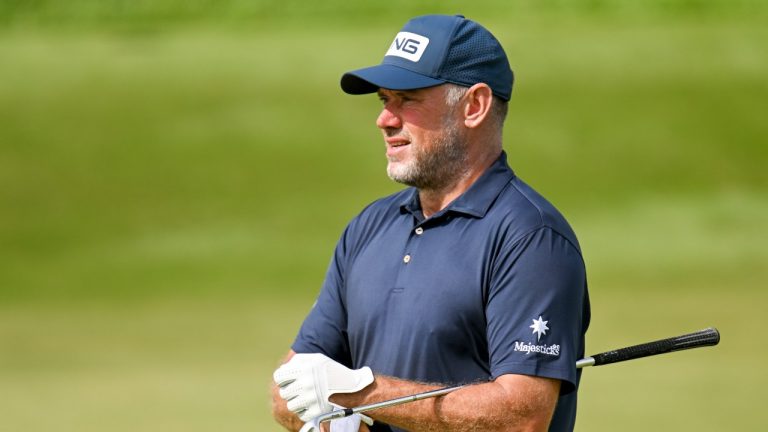 FILE - Lee Westwood from England adjusts his glove on the second hole during LIV Golf Invitational Bangkok 2022 at Stonehill Golf Club in Pathum Thani, Thailand. (AP Photo/Kittinun Rodsupan, File)