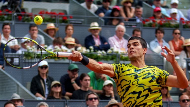 Carlos Alcaraz, of Spain, returns the ball to Alexander Zverev, of Germany, at the Madrid Open tennis tournament in Madrid, Spain, Tuesday, May 2, 2023. (Manu Fernandez/AP)