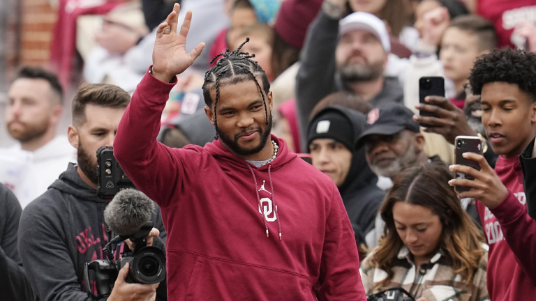 Former Oklahoma quarterback and 2018 Heisman Trophy winner Kyler Murray waves as he is introduced during halftime of the NCAA college football team's spring game Saturday, April 22, 2023, in Norman, Okla. (AP Photo/Sue Ogrocki)