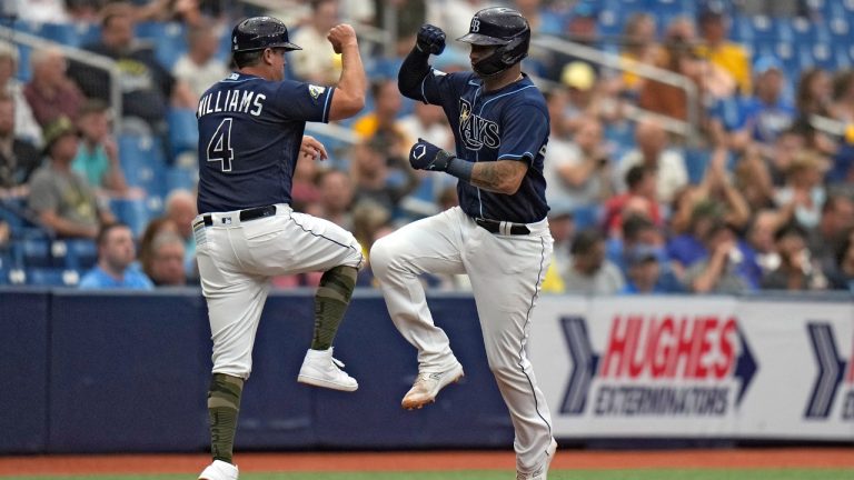 Tampa Bay Rays' Christian Bethancourt celebrates his solo home run off Milwaukee Brewers starting pitcher Eric Lauer with third base coach Brady Williams (4) during the fourth inning of a baseball game Saturday, May 20, 2023, in St. Petersburg, Fla. (Chris O'Meara/AP)