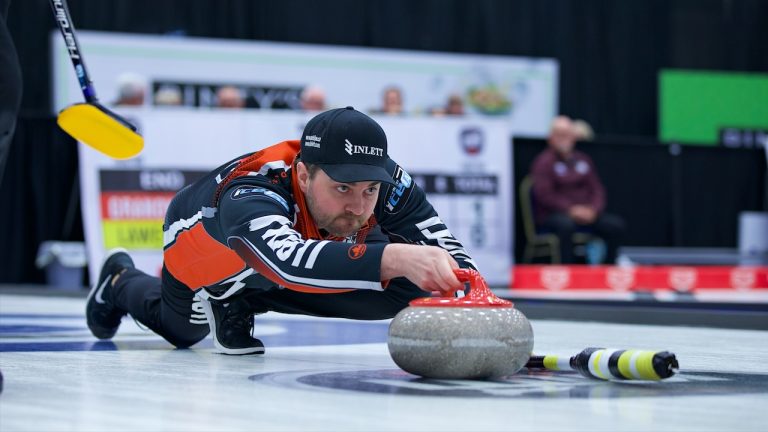 Matt Dunstone shoots a stone during the second draw of the KIOTI Tractor Champions Cup on Tuesday, May 2, 2023, in Regina. (Anil Mungal/GSOC)