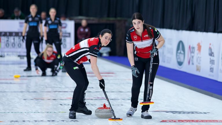 Carole Howard (left) and Rachel Erickson (right) sweep a stone for Team Tirinzoni during the opening draw of the KIOTI Tractor Champions Cup on Tuesday, May 2, 2023, in Regina. (Anil Mungal/GSOC)