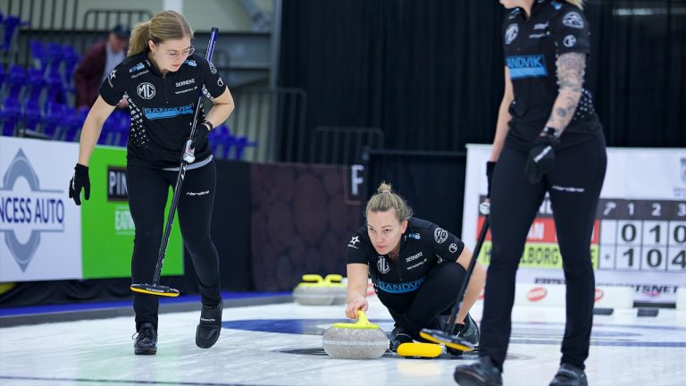 Team Hasselborg's Agnes Knochenhauer (centre) shoots a stone during the eighth draw of the KIOTI Tractor Champions Cup on Thursday, May 4, 2023, in Regina. (Anil Mungal/GSOC)