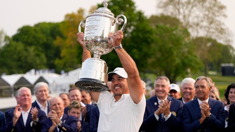 Brooks Koepka holds the Wanamaker trophy after winning the PGA Championship golf tournament at Oak Hill Country Club on Sunday, May 21, 2023, in Pittsford, N.Y. (Eric Gay/AP)