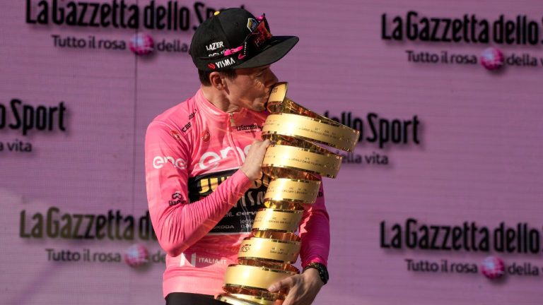 Slovenia's Primoz Roglic kisses the overall winner's trophy at the end of the 21st and last stage of the Giro D'Italia, tour of Italy cycling race, in Rome, Sunday, May 28, 2023. (Alessandra Tarantino/AP)