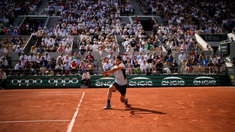 Spain's Carlos Alcaraz plays a shot against Germany's Alexander Zverev during their quarterfinal match at the French Open tennis tournament in Roland Garros stadium in Paris. (Christophe Ena/AP)