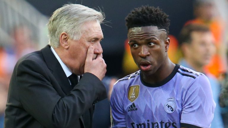 Real Madrid's head coach Carlo Ancelotti, left, gives instructions to Real Madrid's Vinicius Junior during a Spanish La Liga soccer match between Valencia and Real Madrid, at the Mestalla stadium in Valencia, Spain, Sunday, May 21, 2023. (Alberto Saiz/AP Photo)