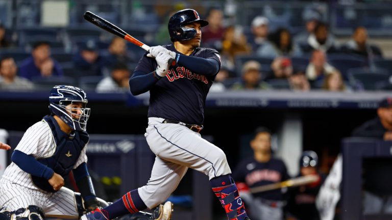 Cleveland Guardians' Josh Naylor, right, singles in two runs against the New York Yankees in the ninth inning of a baseball game, Monday, May 1, 2023, in New York. (Rich Schultz/AP)