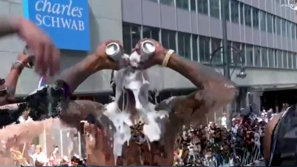 Beer can breaks trophy during Red Sox World Series parade 