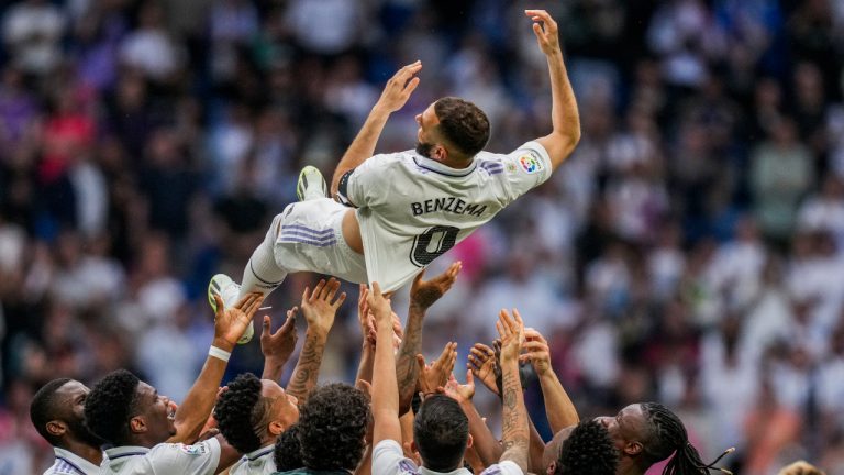 Real Madrid's Karim Benzema is thrown in the air by teammates after their Spanish La Liga soccer match against Athletic Bilbao at the Santiago Bernabeu stadium in Madrid, Sunday, June 4, 2023. (Bernat Armangue/AP)