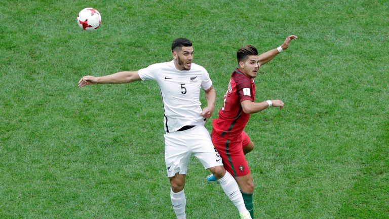 Portugal's Andre Silva, right, New Zealand's Michael Boxall jump for the ball during the Confederations Cup, Group A soccer match between New Zealand and Portugal, at the St. Petersburg Stadium, Russia, Saturday, June 24, 2017. (Dmitri Lovetsky/AP)