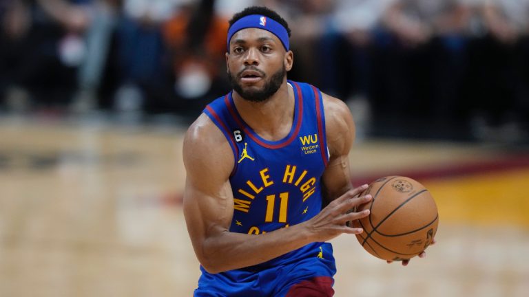 Denver Nuggets forward Bruce Brown (11) looks to pass the ball during the first half of Game 3 of the NBA Finals basketball game against the Miami Heat, Wednesday, June 7, 2023, in Miami. (Wilfredo Lee/AP)