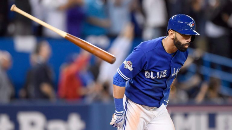 Toronto Blue Jays' Jose Bautista flips his bat after hitting a three-run home run against the Texas Rangers during the seventh inning of game 5 American League Division Series baseball action in Toronto on Wednesday, Oct. 14, 2015. (Frank Gunn/CP)