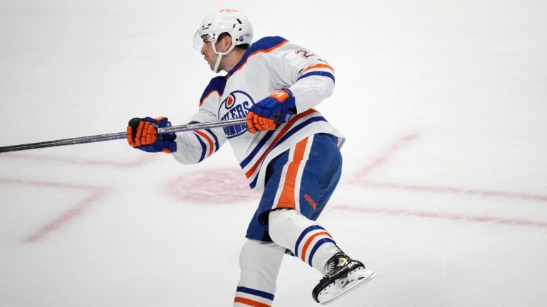 Edmonton Oilers defenseman Evan Bouchard follows through on his overtime goal against the Colorado Avalanche in an NHL hockey game Tuesday, April 11, 2023, in Denver. (David Zalubowski/AP)