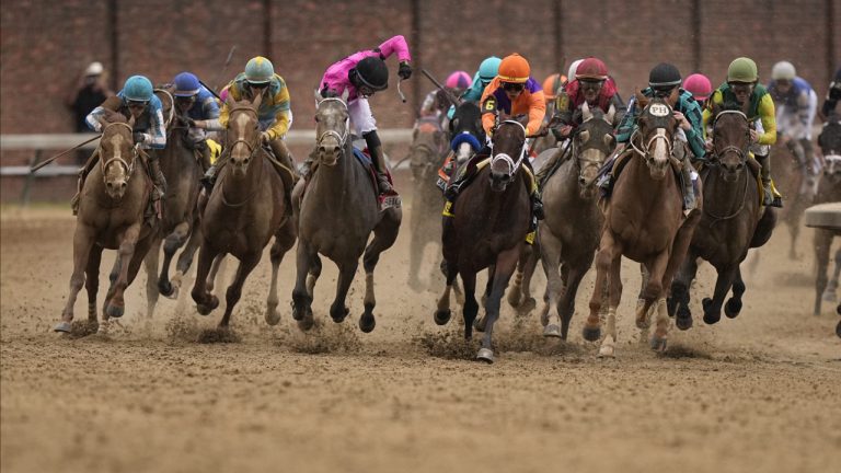 Horses round the fourth turn. (Brynn Anderson/AP)