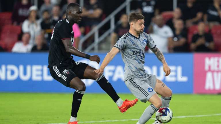 CF Montreal defender Gabriele Corbo, right, blocks a kick by D.C. United forward Christian Benteke during the second half of an MLS soccer match in Washington, Wednesday, May 31, 2023. The game ended in a 2-2 draw. (AP Photo/Manuel Balce Ceneta)