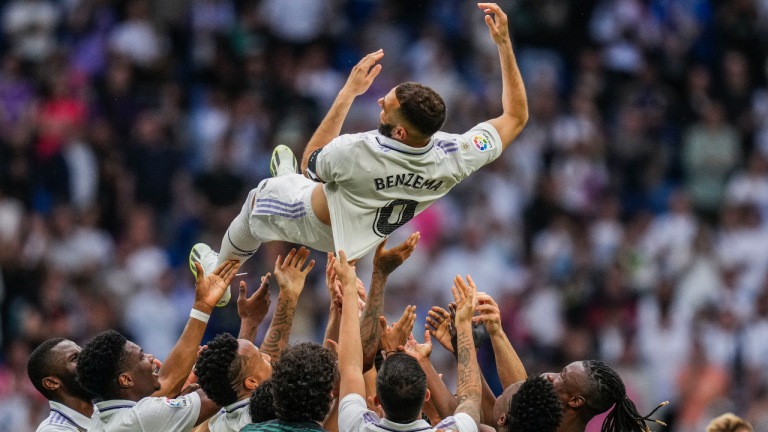 Real Madrid's Karim Benzema is thrown in the air by teammates after their Spanish La Liga soccer match against Athletic Bilbao at the Santiago Bernabeu stadium in Madrid, Sunday, June 4, 2023. (AP Photo/Bernat Armangue)