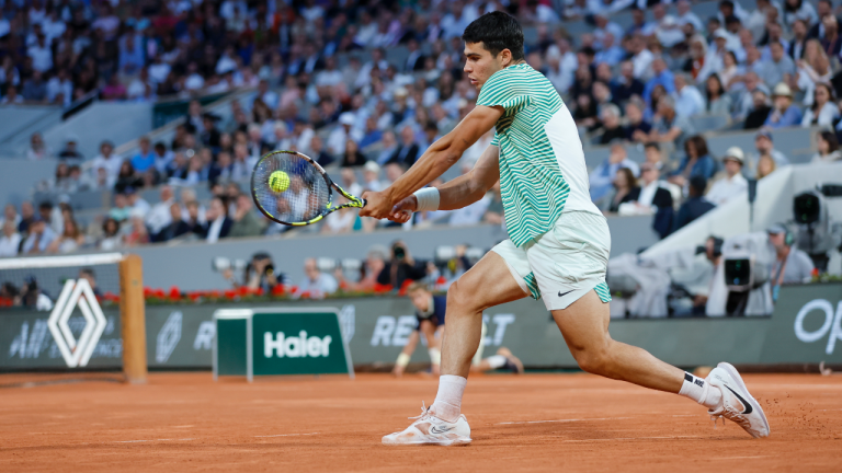 Spain's Carlos Alcaraz plays a shot against Greece's Stefanos Tsitsipas during their quarterfinal match of the French Open tennis tournament at the Roland Garros stadium in Paris, Tuesday, June 6, 2023. (AP Photo/Jean-Francois Badias)