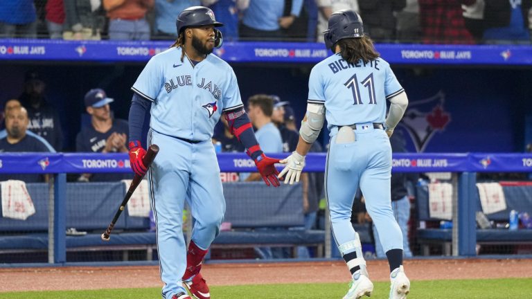 Toronto Blue Jays shortstop Bo Bichette (11) celebrates his home run against the Houston Astros with teammate first baseman Vladimir Guerrero Jr. (27) in eighth inning American League MLB baseball action in Toronto on Tuesday, June 6, 2023. (Andrew Lahodynskyj/CP)