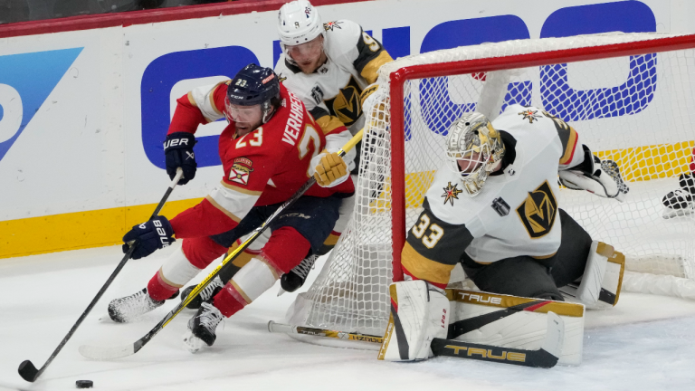 Vegas Golden Knights center Jack Eichel (9) defends Florida Panthers center Carter Verhaeghe (23), as goaltender Adin Hill (33) protects the net during the first period of Game 3 of the NHL hockey Stanley Cup Finals, Thursday, June 8, 2023, in Sunrise, Fla. (AP)