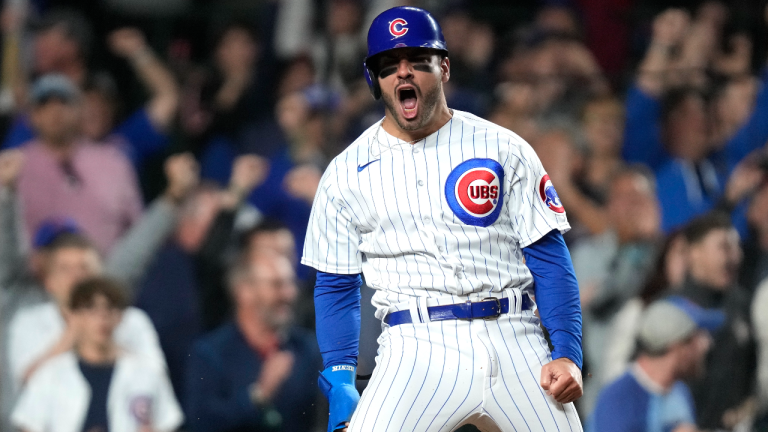 Chicago Cubs' Mike Tauchman reacts after scoring on a two-run single by Ian Happ off Pittsburgh Pirates relief pitcher Yohan Ramirez during the sixth inning of a baseball game Wednesday, June 14, 2023, in Chicago. (AP)