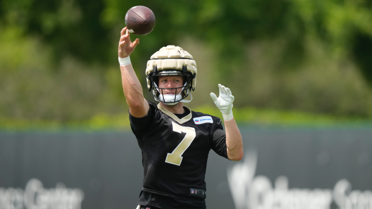 New Orleans Saints tight end Taysom Hill (7) runs through drills at the team's NFL football minicamp in Metairie, La., Thursday, June 15, 2023. (AP Photo/Gerald Herbert)