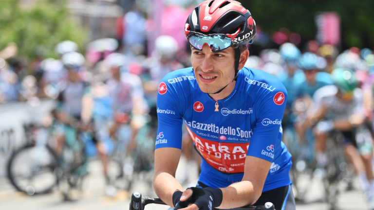 Gino Mader waits for the start of the 7th stage of the Giro d'Italia, Tour of Italy cycling race, in Notaresco, Italy, on May 14, 2021. Swiss cyclist Gino Mader has died Friday, June 16, 2023 one day after suffering injuries when he crashed off the road down a ravine during a descent at the Tour de Suisse. (AP)