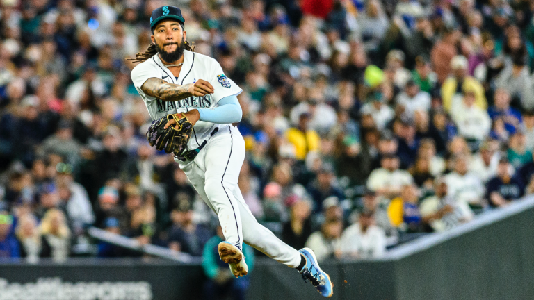 Seattle Mariners shortstop J.P. Crawford throws to first baseman Ty France for an out against Chicago White Sox's Jake Burger during the eighth inning of a baseball game, Sunday, June 18, 2023, in Seattle. (Caean Couto/AP)