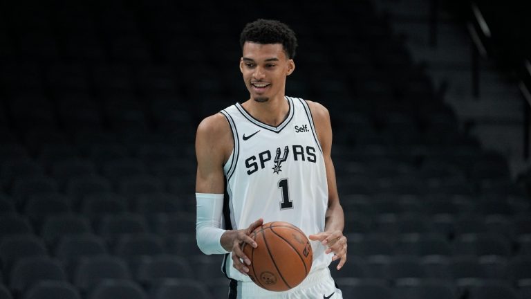 San Antonio Spurs NBA basketball first round draft pick Victor Wembanyama handles the ball following an introductory news conference in San Antonio, Saturday, June 24, 2023. (AP)