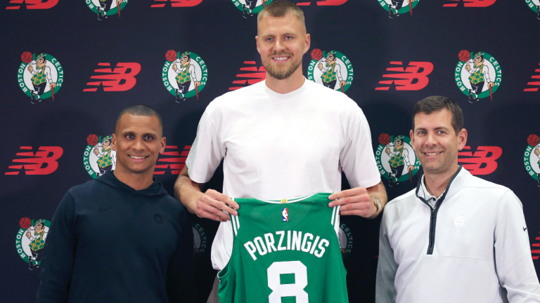 Boston Celtics center Kristaps Porzingis, center, poses with head coach Joe Mazzulla, left, and Brad Stevens, president of basketball operations, during a media availability, Thursday June 29, 2023, in Boston. (AP)