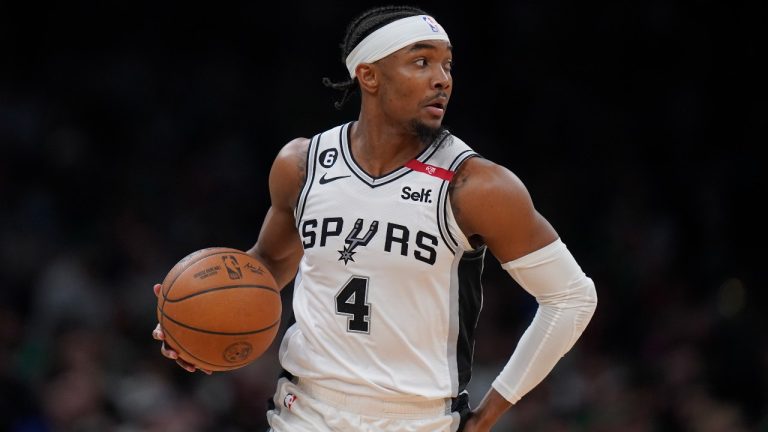 San Antonio Spurs guard Devonte' Graham runs with the ball during the second half of an NBA basketball game against the Boston Celtics, March 26, 2023, in Boston. (Steven Senne/AP)