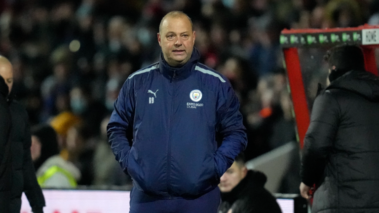 Manchester City assistant coach Rodolfo Borrell stands on the touchline during the English FA Cup third round soccer match between Swindon Town and Manchester City at the County Ground stadium in Swindon, Wiltshire, England, Friday, Jan. 7, 2022 (AP)